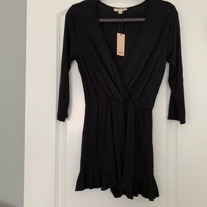 Medium black romper NWT